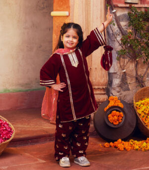 Maroon kurta with matching salwar and dupatta
